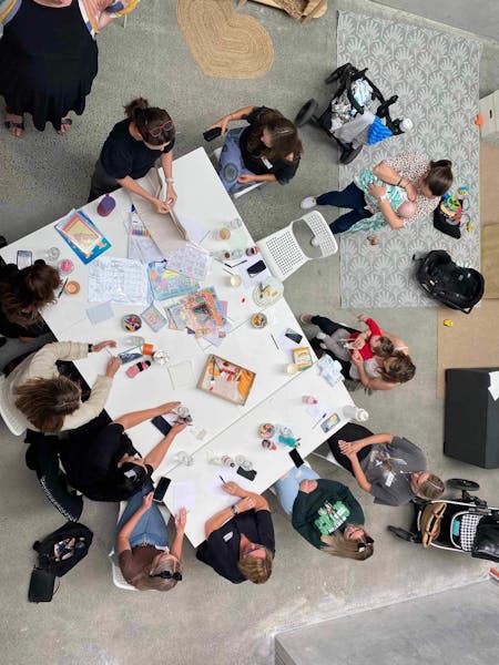 Overhead view of arts and crafts being done on a table